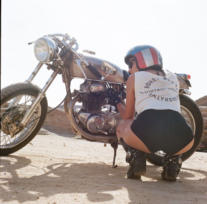A playful frame from Girls on a motorcycle — online in Chicago